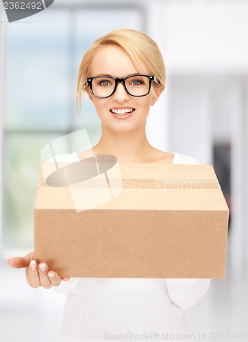 Image of attractive businesswoman with cardboard box