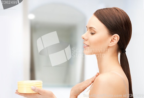 Image of beautiful woman with moisturizing creme