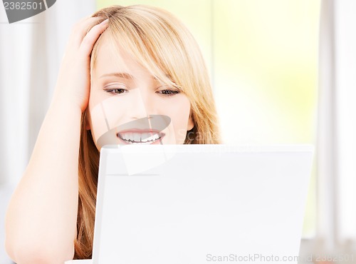 Image of teenage girl with laptop computer