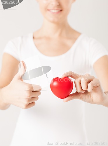 Image of woman hands with heart