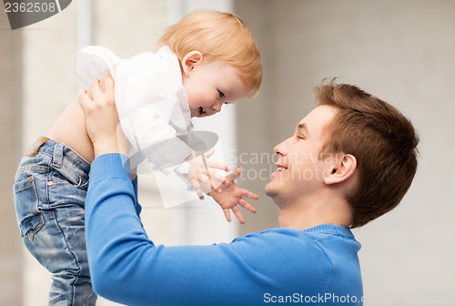 Image of happy father with adorable baby