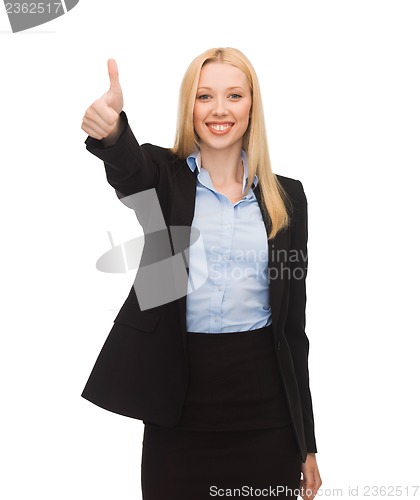 Image of young businesswoman with thumbs up