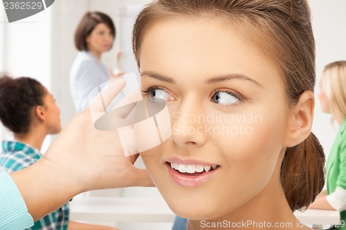 Image of student girl listening gossip at school