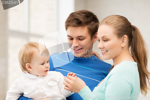 Image of happy family with adorable baby