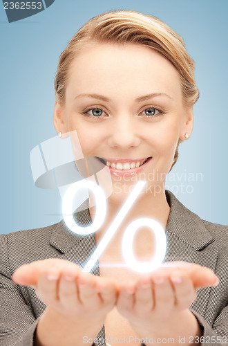 Image of woman showing sign of percent in her hands