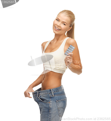 Image of woman with pants and pills