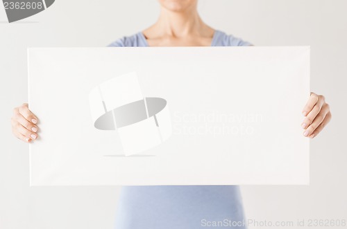 Image of woman with blank white board