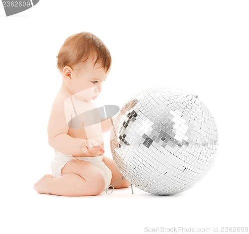 Image of child playing with disco ball