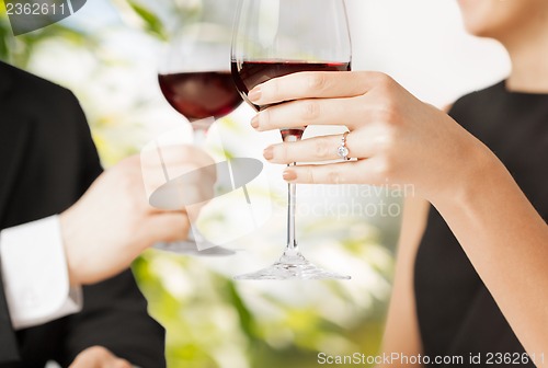 Image of engaged couple with wine glasses