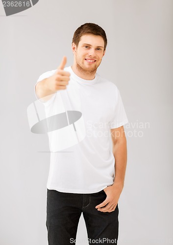 Image of man showing thumbs up