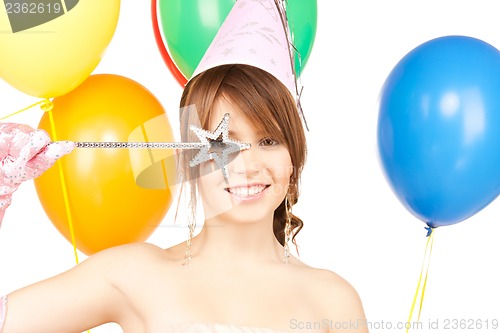 Image of happy girl with colorful balloons