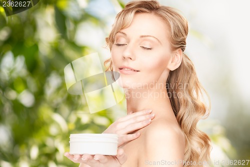Image of beautiful woman with moisturizing creme
