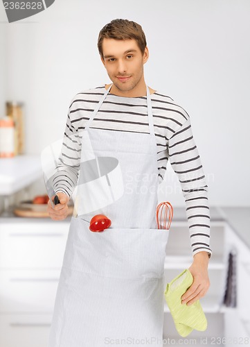 Image of handsome man with knife