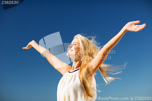 Image of beautiful woman enjoying summer outdoors