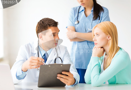 Image of male doctor with patient