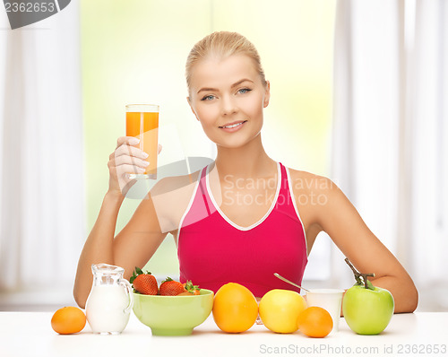 Image of young woman eating healthy breakfast