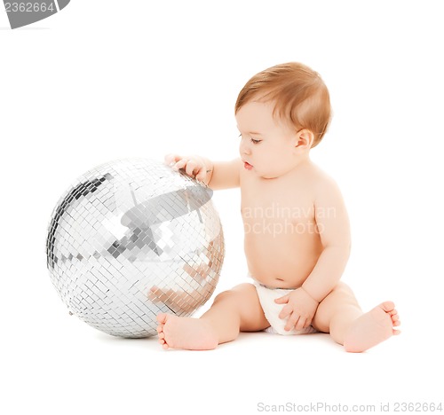 Image of child playing with disco ball
