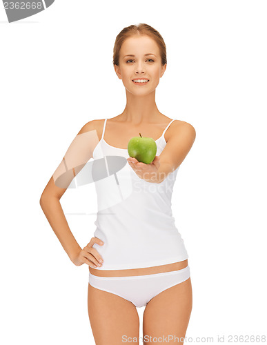 Image of woman in white underwear holding green apple