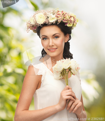 Image of woman wearing wreath of flowers