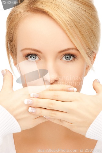 Image of amazed woman with hand over mouth