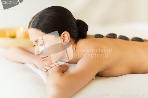 Image of woman in spa with hot stones