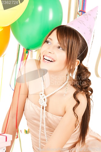 Image of happy girl with colorful balloons