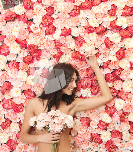 Image of woman and background full of roses