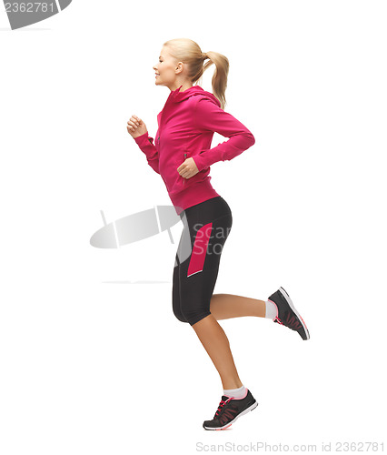 Image of sporty woman running or jumping