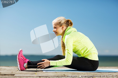 Image of woman doing sports outdoors