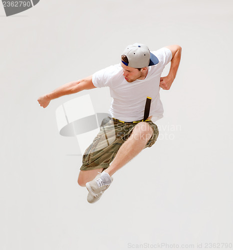 Image of male dancer jumping in the air