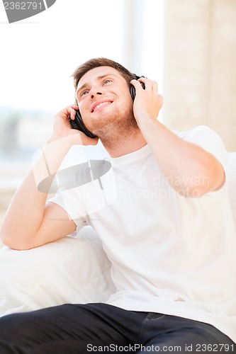 Image of man with headphones listening to music