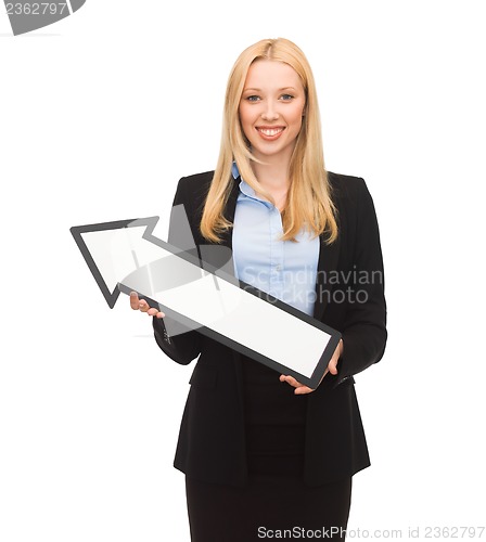 Image of smiling businesswoman with direction arrow sign