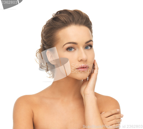 Image of face and hands of beautiful woman