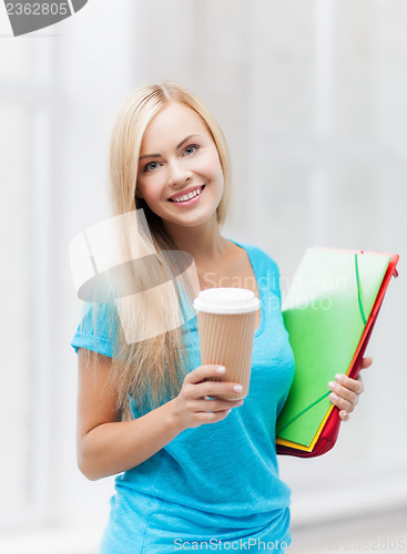 Image of smiling student with folders