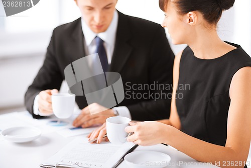 Image of woman hand signing contract paper