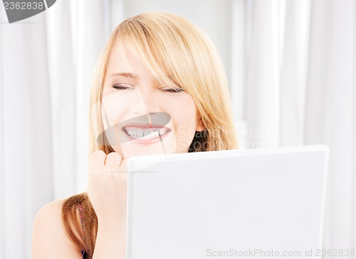 Image of teenage girl with laptop computer