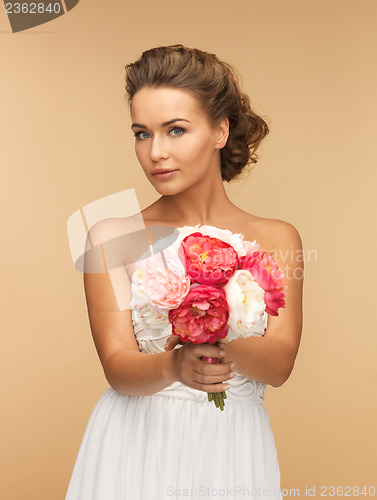 Image of woman with bouquet of flowers