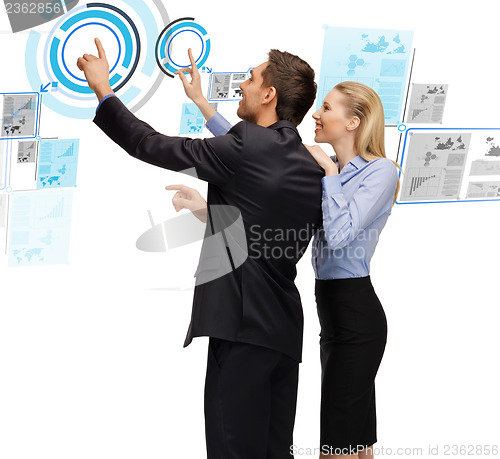 Image of man and woman working with virtual screen