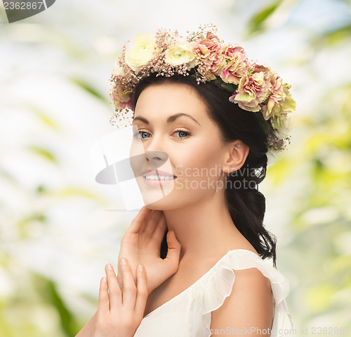 Image of woman wearing wreath of flowers