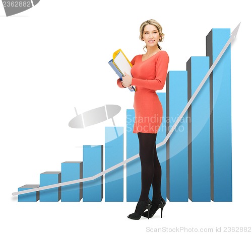 Image of businesswoman with big 3d chart and folders