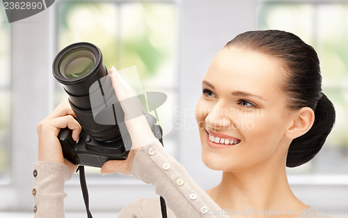 Image of teenage girl with digital camera