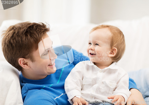 Image of happy father with adorable baby