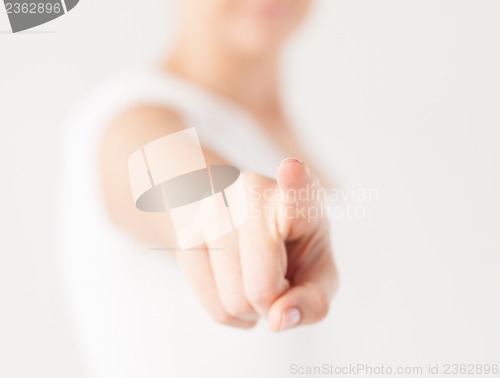 Image of woman pointing her finger at you