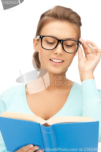 Image of woman in glasses reading book