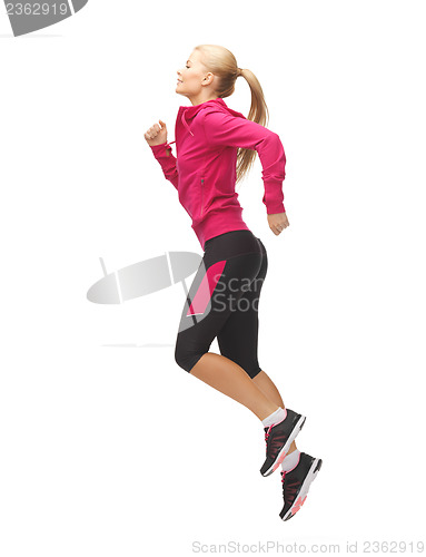 Image of sporty woman running or jumping