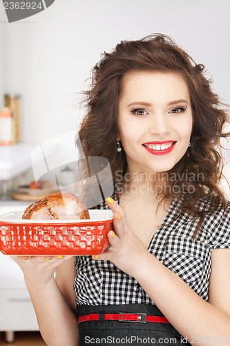 Image of lovely housewife with meat