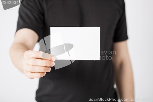 Image of man hand with blank paper