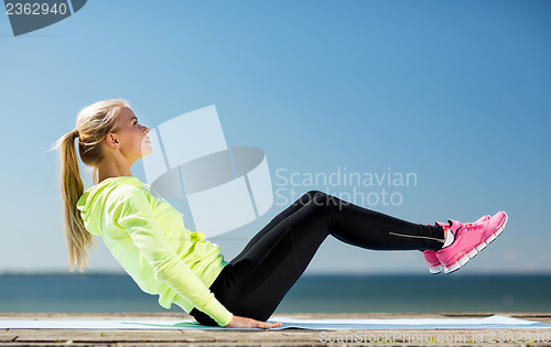 Image of woman doing sports outdoors