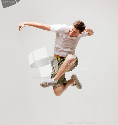 Image of male dancer jumping in the air