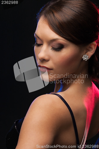 Image of woman with diamond earrings